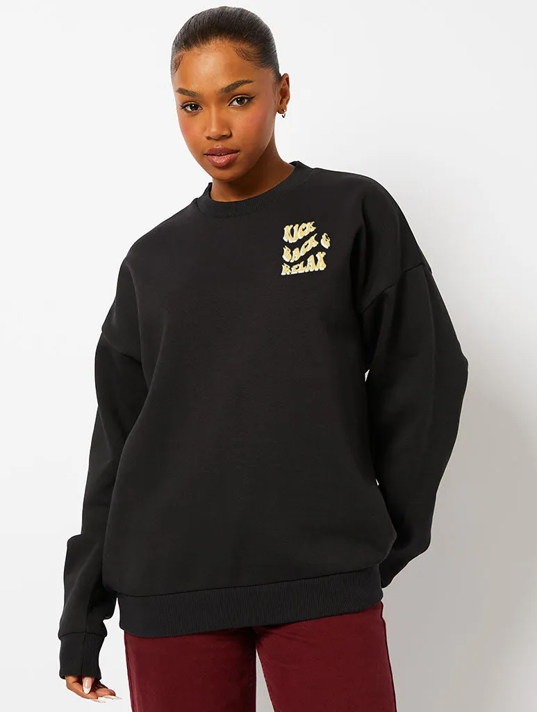 Peanuts x Skinnydip Snoopy Kick Back & Relax Sweatshirt in Black sold by Skinnydip London product image thumbnail 2