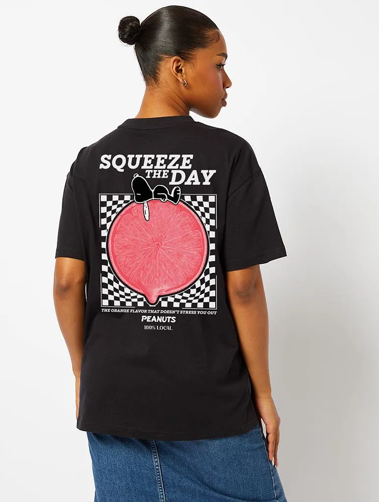 Peanuts x Skinnydip Snoopy Squeeze the Day T-Shirt in Black sold by Skinnydip London
