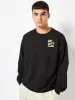 Peanuts x Skinnydip Snoopy Kick Back & Relax Sweatshirt in Black sold by Skinnydip London