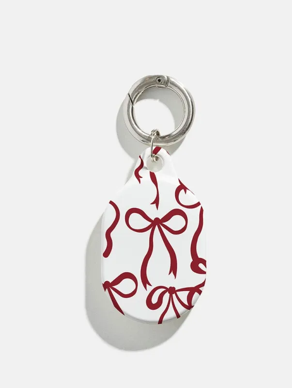 Burgundy Bows AirTag Case in Gloss sold by Skinnydip London