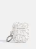 Neutral Bows AirPods Case sold by Skinnydip London