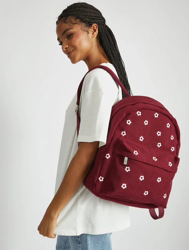 Burgandy Ditsy Flower Embroidered Backpack sold by Skinnydip London