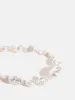 Chunky Pearl Beaded Charm Strap sold by Skinnydip London