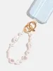 Chunky Pearl Beaded Charm Strap sold by Skinnydip London