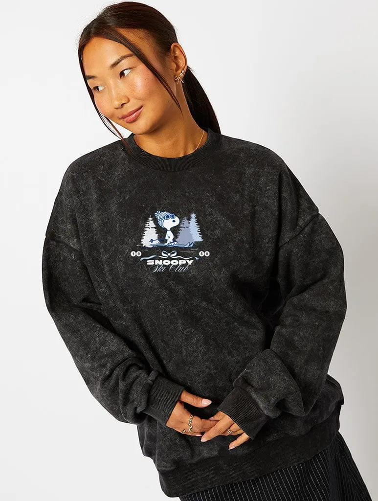 Peanuts x Skinnydip Snoopy Ski Club Sweatshirt in Acid Wash sold by Skinnydip London
