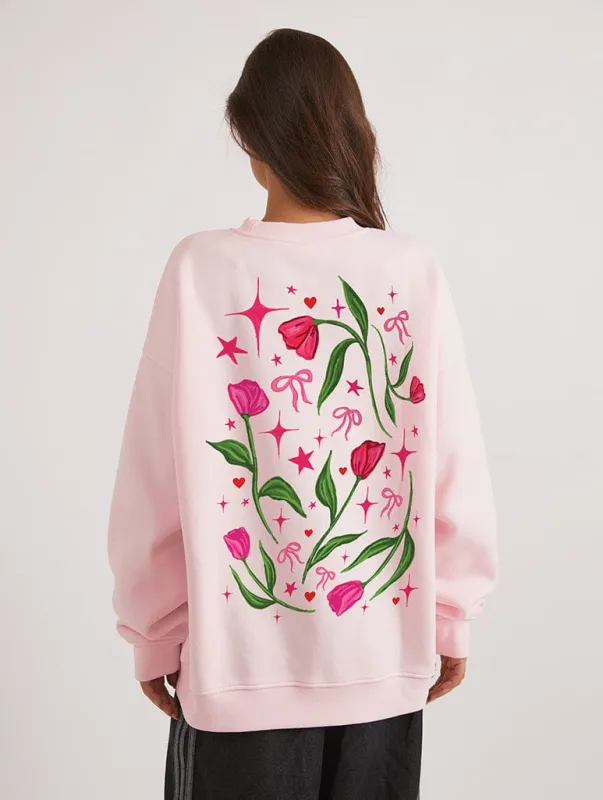 Love Grows Here Sweatshirt In Pink sold by Skinnydip London