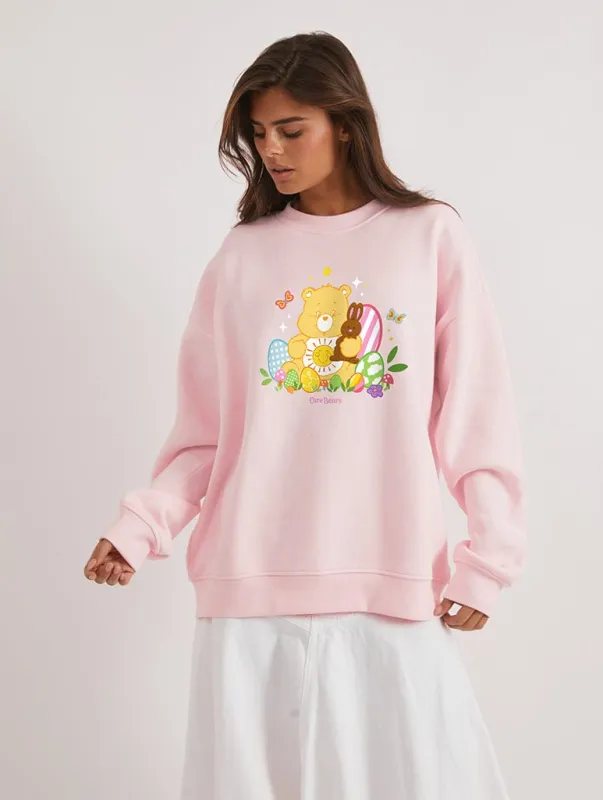 Care Bears x Skinnydip Funshine Bear Easter Egg Sweatshirt In Pink sold by Skinnydip London