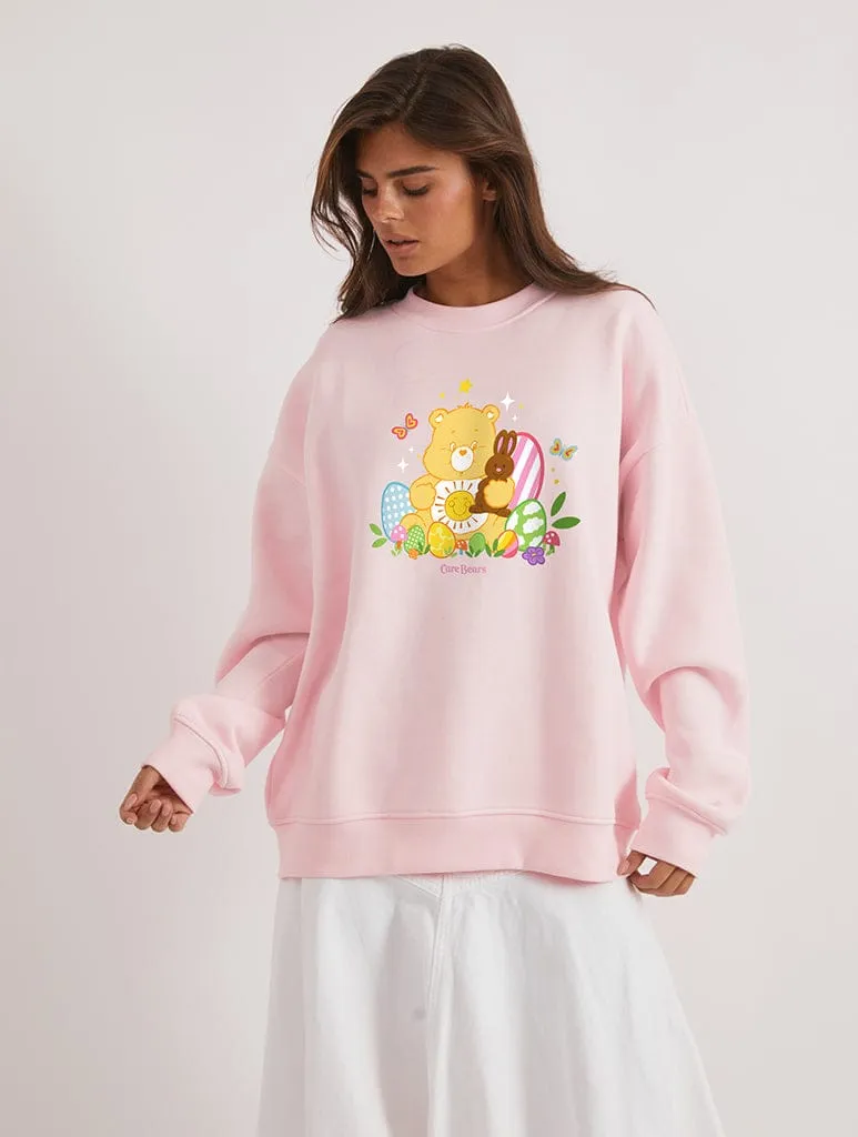 Care Bears x Skinnydip Funshine Bear Easter Egg Sweatshirt In Pink sold by Skinnydip London