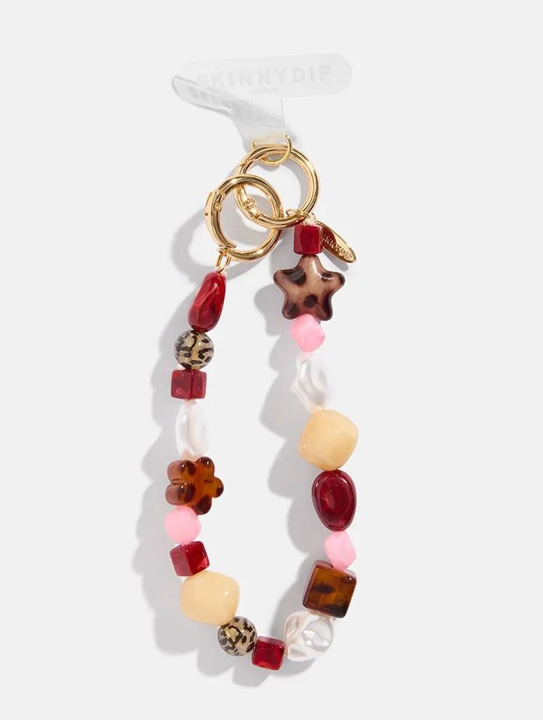 Burgundy Tortoise Shell Phone Charm sold by Skinnydip London