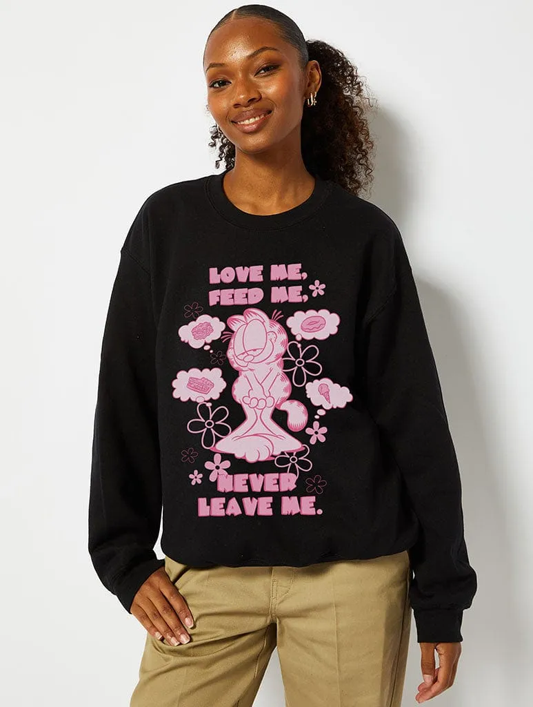 Garfield x Skinnydip Love Me, Feed Me, Never Leave Me Sweatshirt in Black sold by Skinnydip London