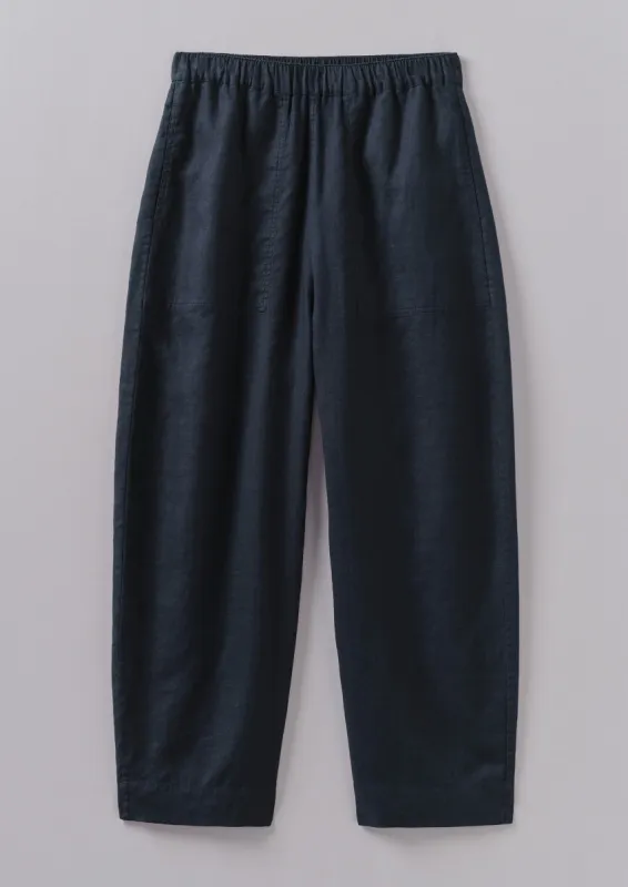 Garment Dyed Lightweight Linen Barrel Leg Trousers | Midnight sold by TOAST
