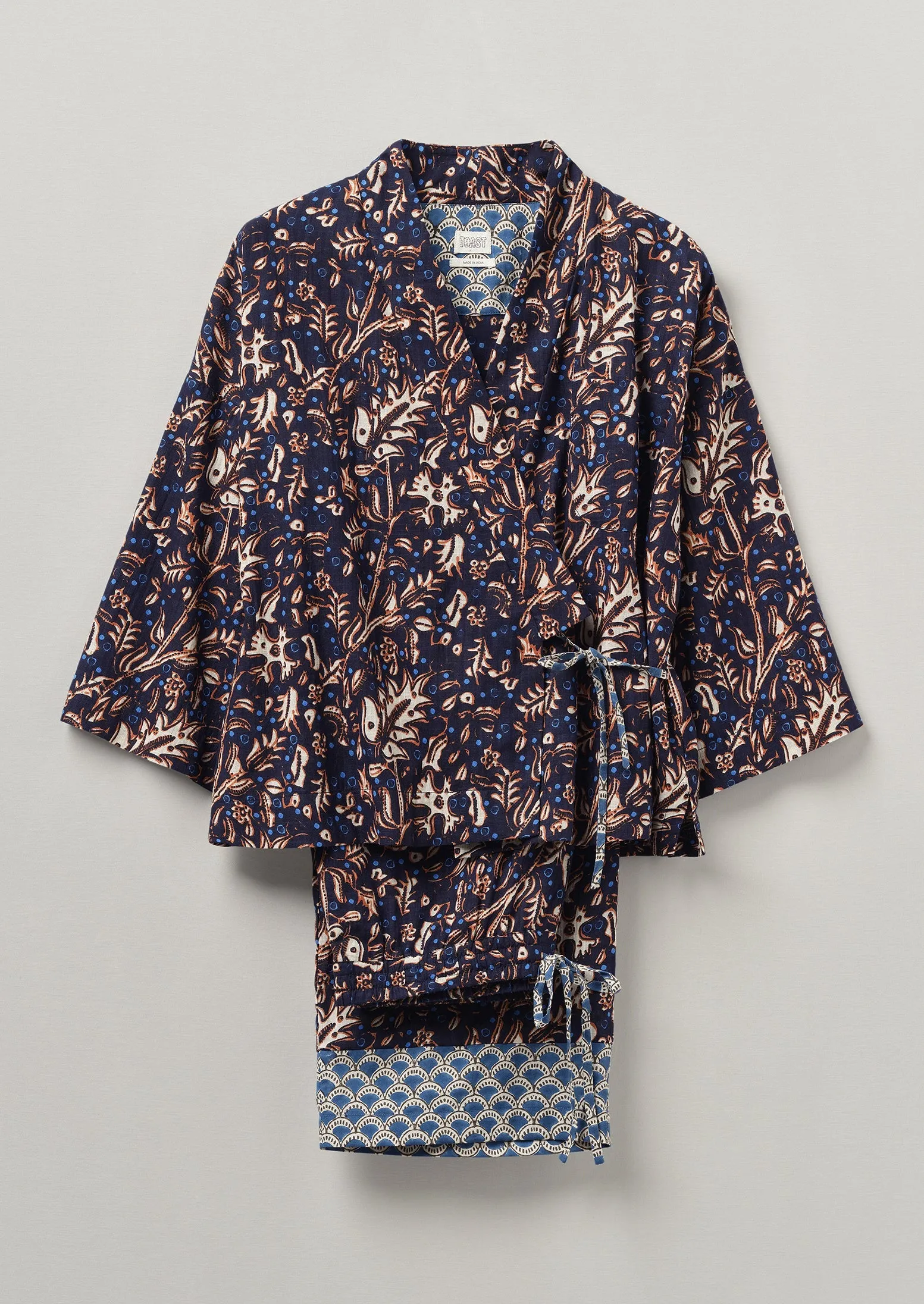 Scattered Floral Organic Cotton Pyjamas | Navy sold by TOAST