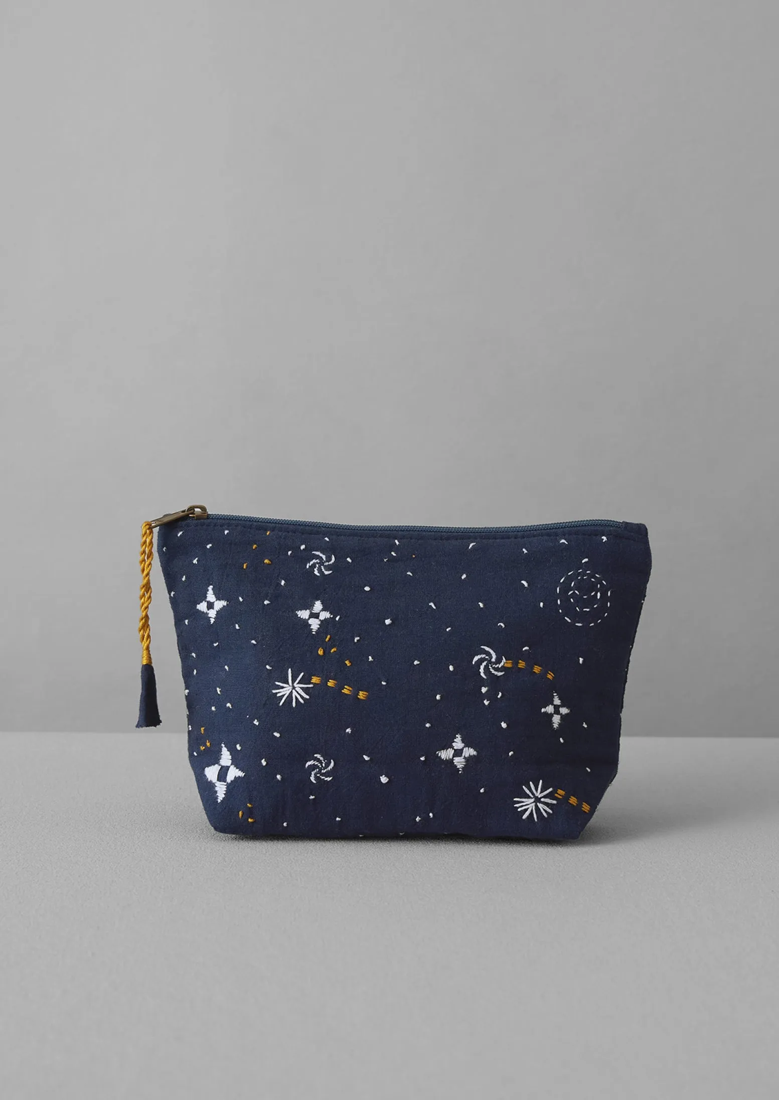 Hand Embroidered Celestial Pouch | Indigo sold by TOAST