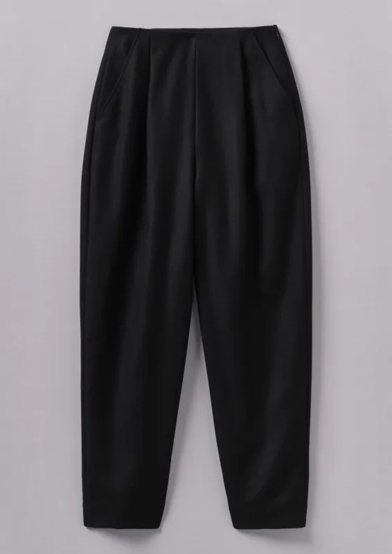 Wool Flannel Pleat Front Trousers | Black sold by TOAST