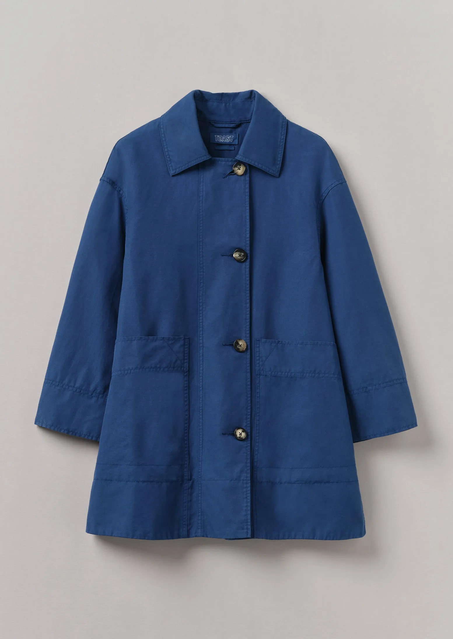 A Line Cotton Linen Canvas Coat | Dark Ash Blue sold by TOAST