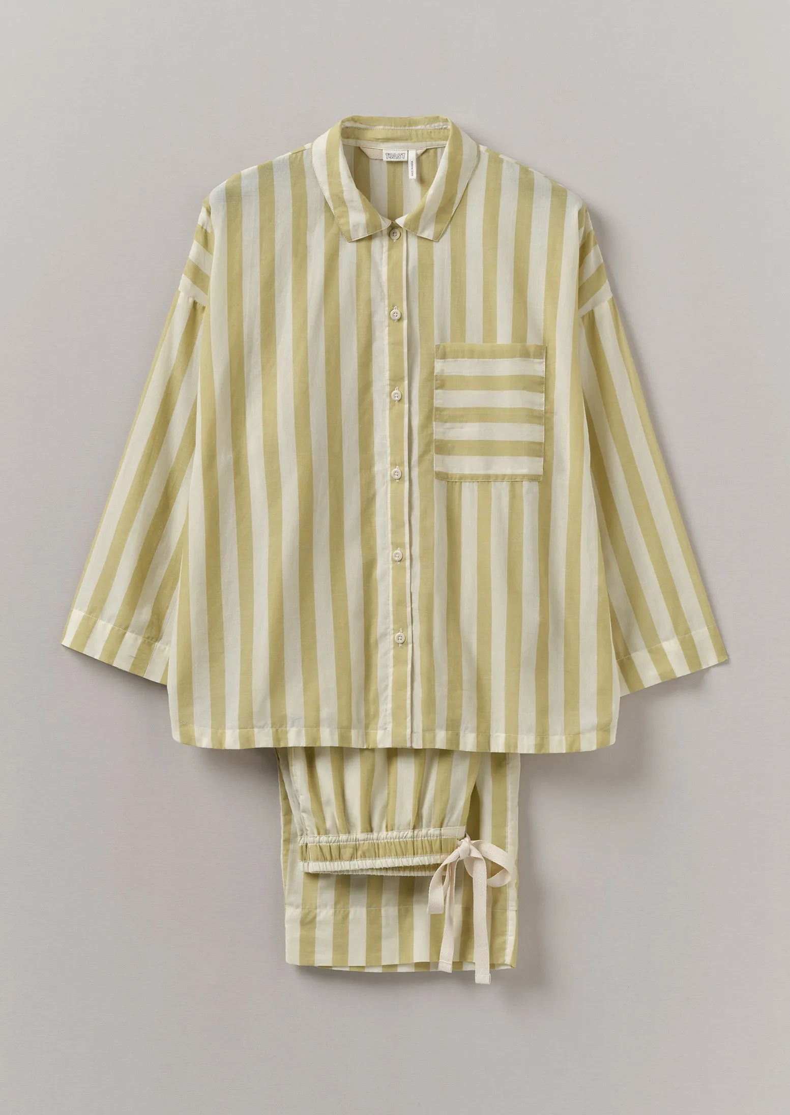 Canopy Stripe Organic Cotton Pyjamas | Ecru/Washed Lime sold by TOAST