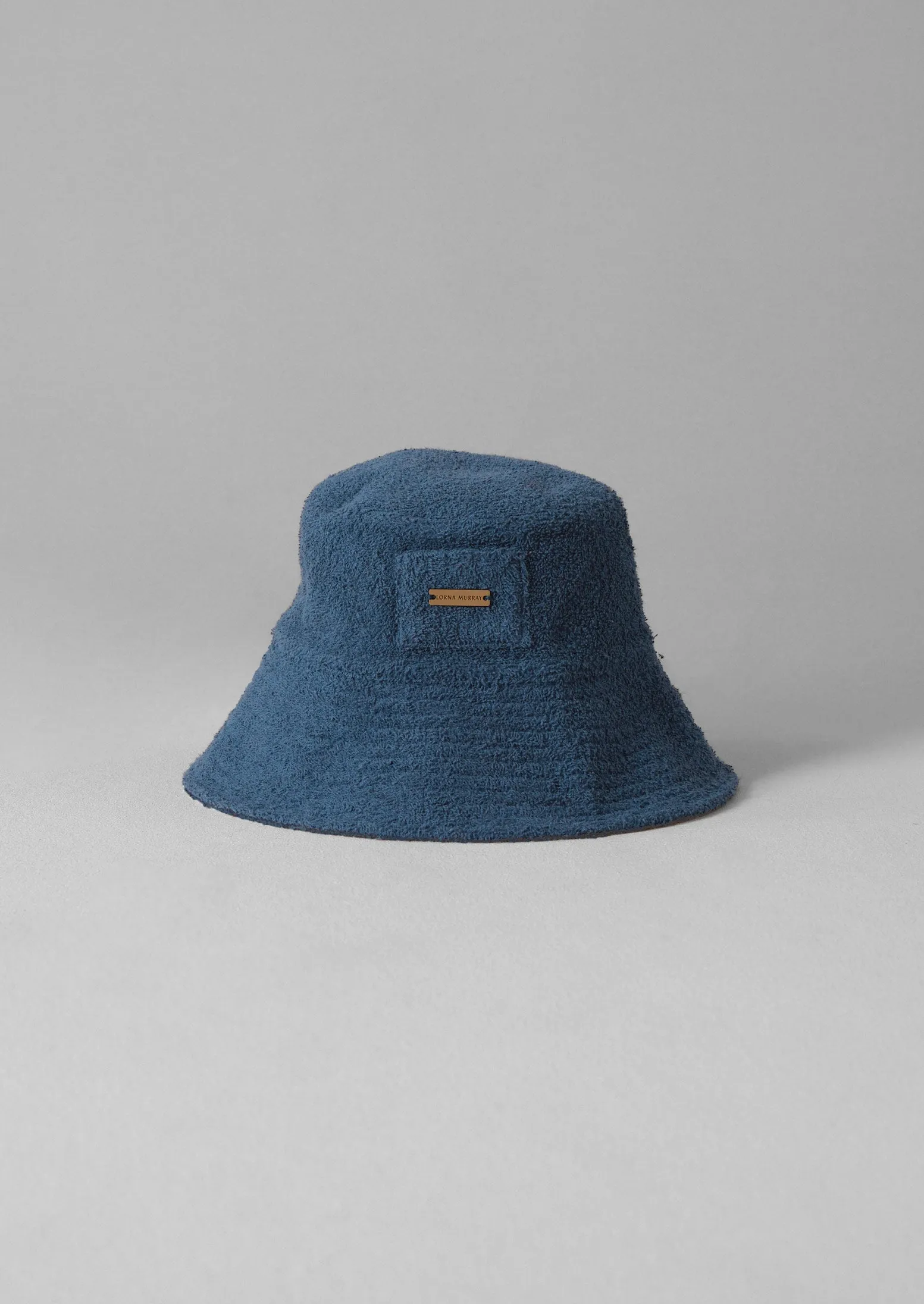 Lorna Murray Towelling Hat | Blue sold by TOAST