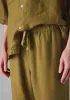 Alfie Garment Dyed Linen Trousers | Durian Green sold by TOAST