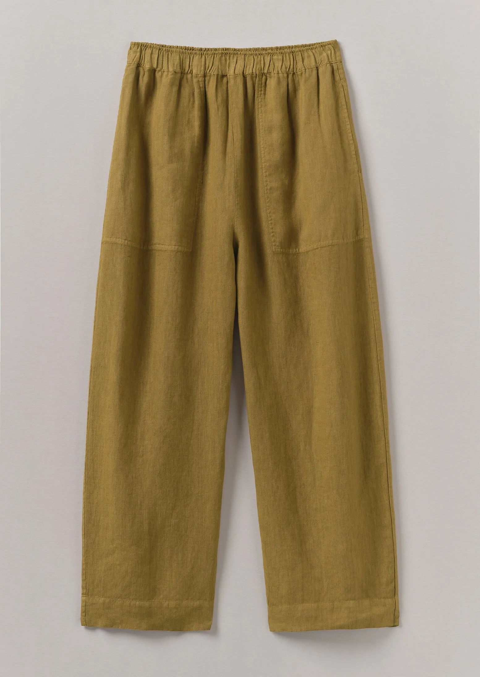 Garment Dyed Lightweight Linen Barrel Leg Trousers | Durian Green sold by TOAST