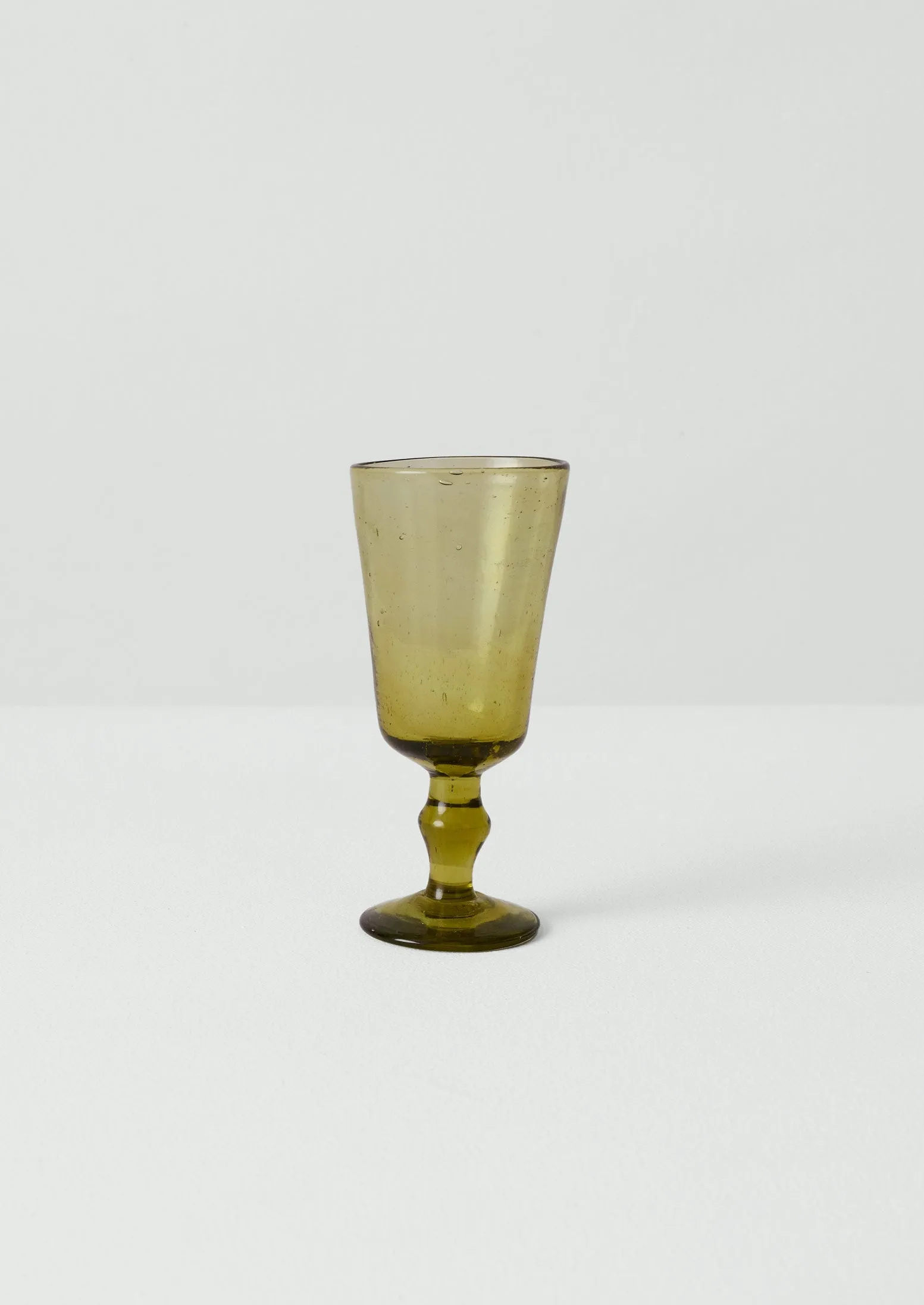 Hand Blown Wine Glass | Olive sold by TOAST