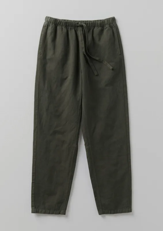 Alfie Garment Dyed Herringbone Trousers | Dark Moss sold by TOAST