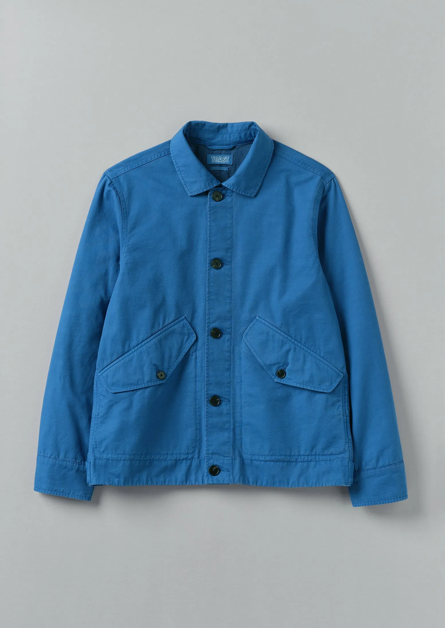 Garment Dyed Organic Cotton Coach Jacket | Flask Blue sold by TOAST