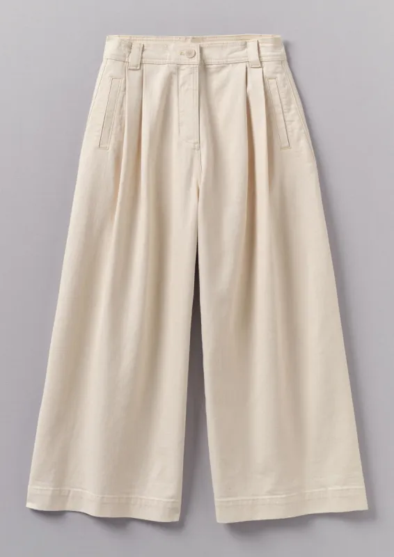 Ecru Denim Pleat Front Trousers | Ecru sold by TOAST
