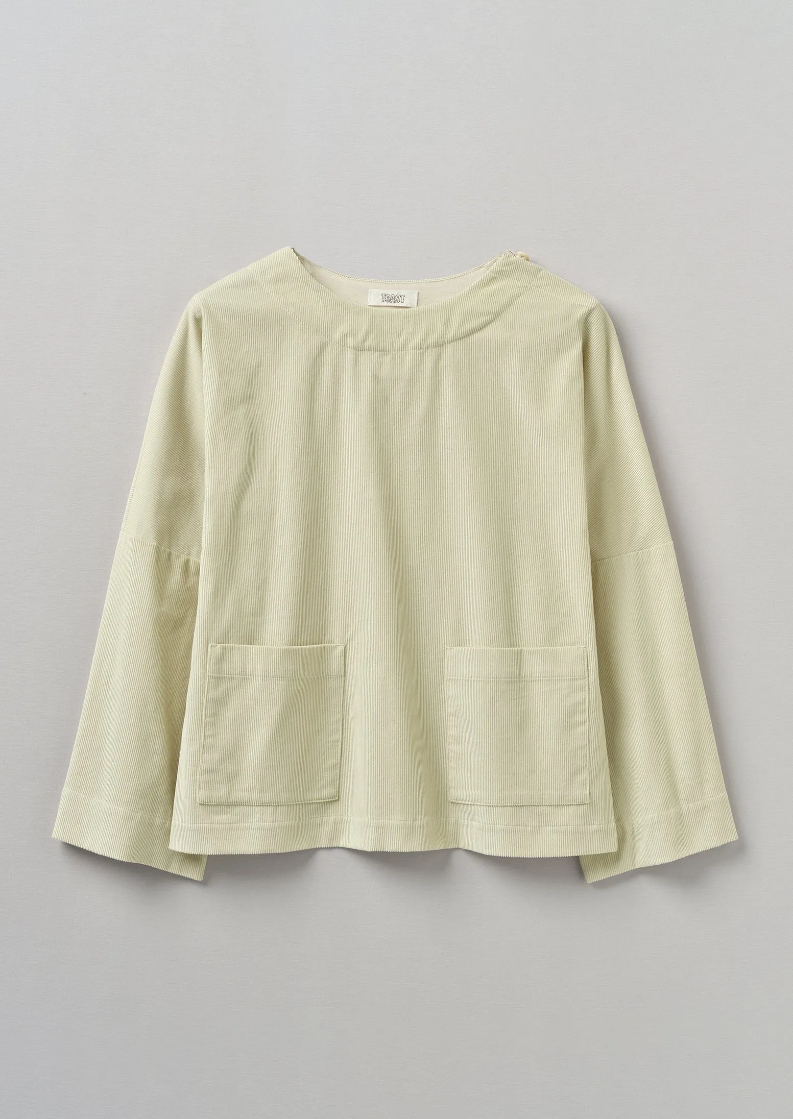 Button Shoulder Organic Cord Smock | Limestone sold by TOAST