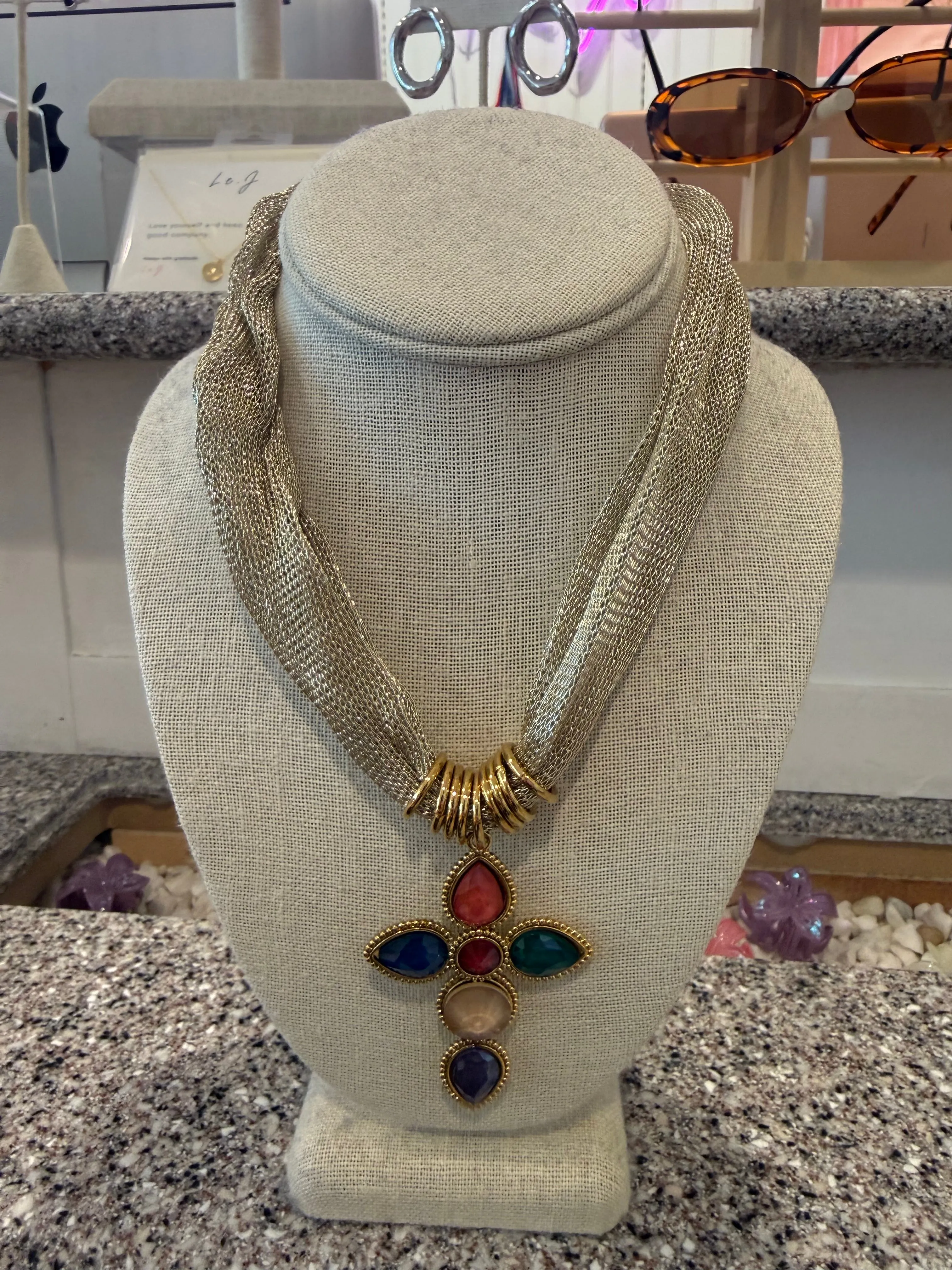 Muli-color stone cross necklace sold by Rock N Rags