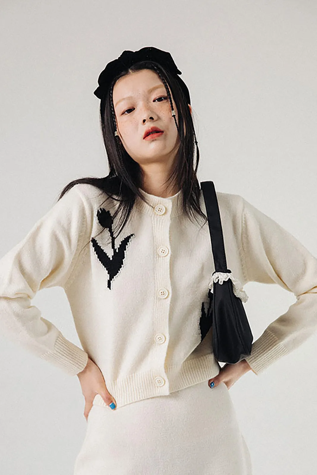 The She Loves Me Not Cardigan sold by Kina and Tam