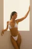 Love Me Triangle Bikini Top sold by Dippin Daisy’s