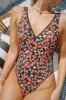 Hefner V-Neck Ruffle One Piece sold by Dippin Daisy’s