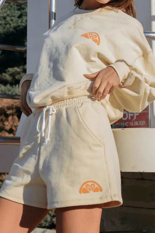 Clementine Drawstring Sweat Shorts sold by Dippin Daisy’s