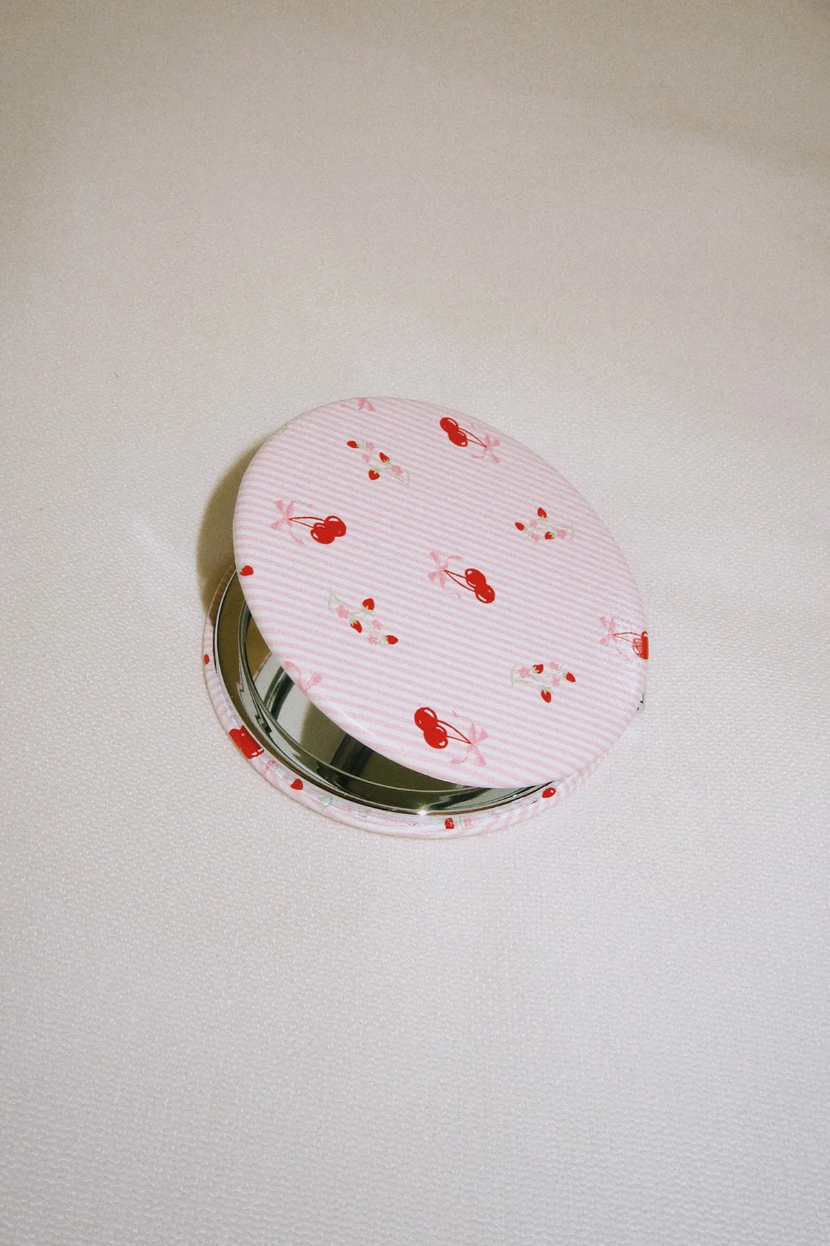 Compact Mirror sold by Dippin Daisy’s