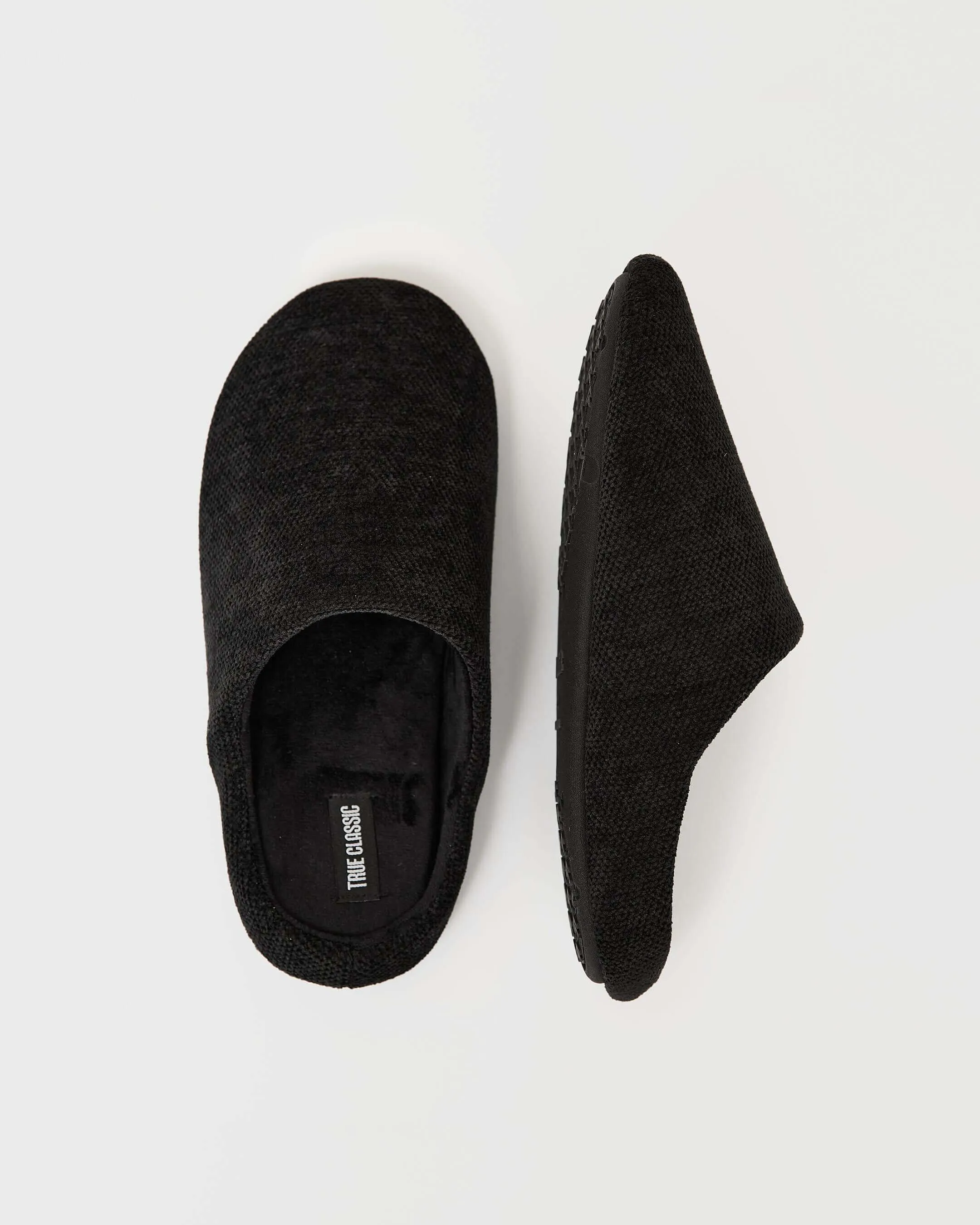 Black Slippers sold by True Classic