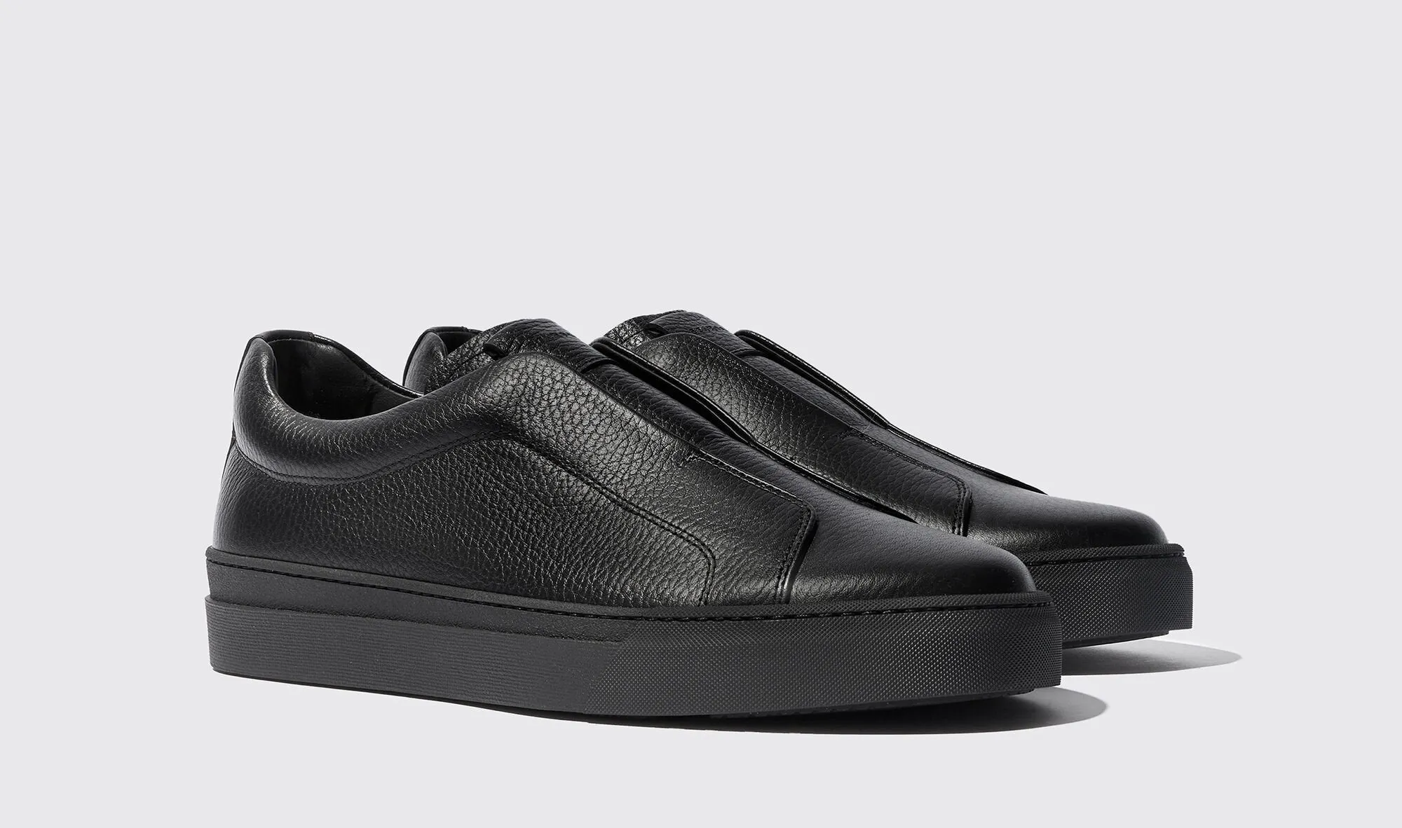 Black Leather Surge Slipon Sneakers sold by Costoso Italiano