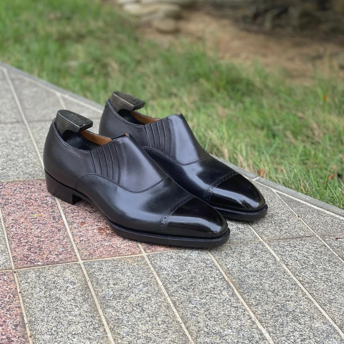 Black Leather Midara Slip On Elasticated Loafers With Brogue Toe Cap - AW24 sold by Costoso Italiano