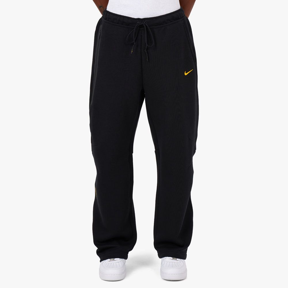 Nike NOCTA Tech Fleece Sweatpants Black / University Gold sold by Livestock