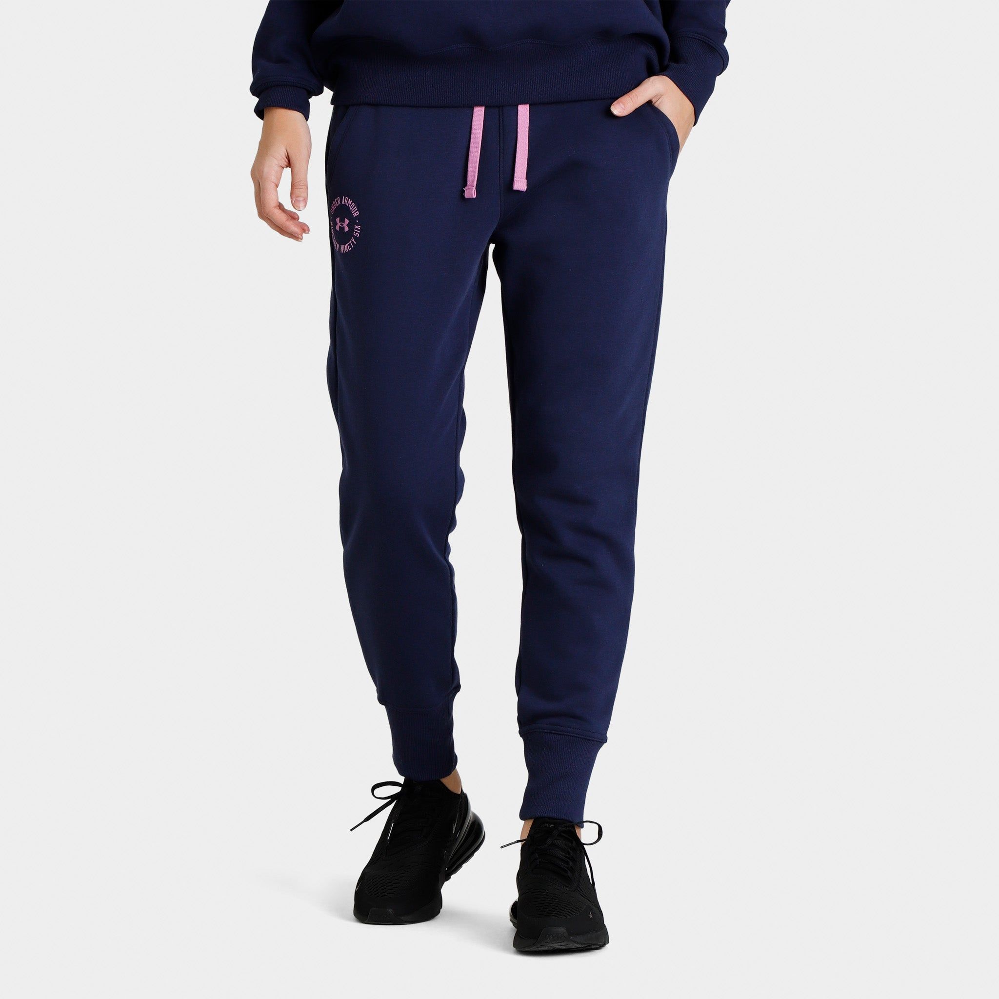 Under Armour Women’s Rival Fleece Crest Joggers Midnight Navy / Jellyfish sold by JD Sports