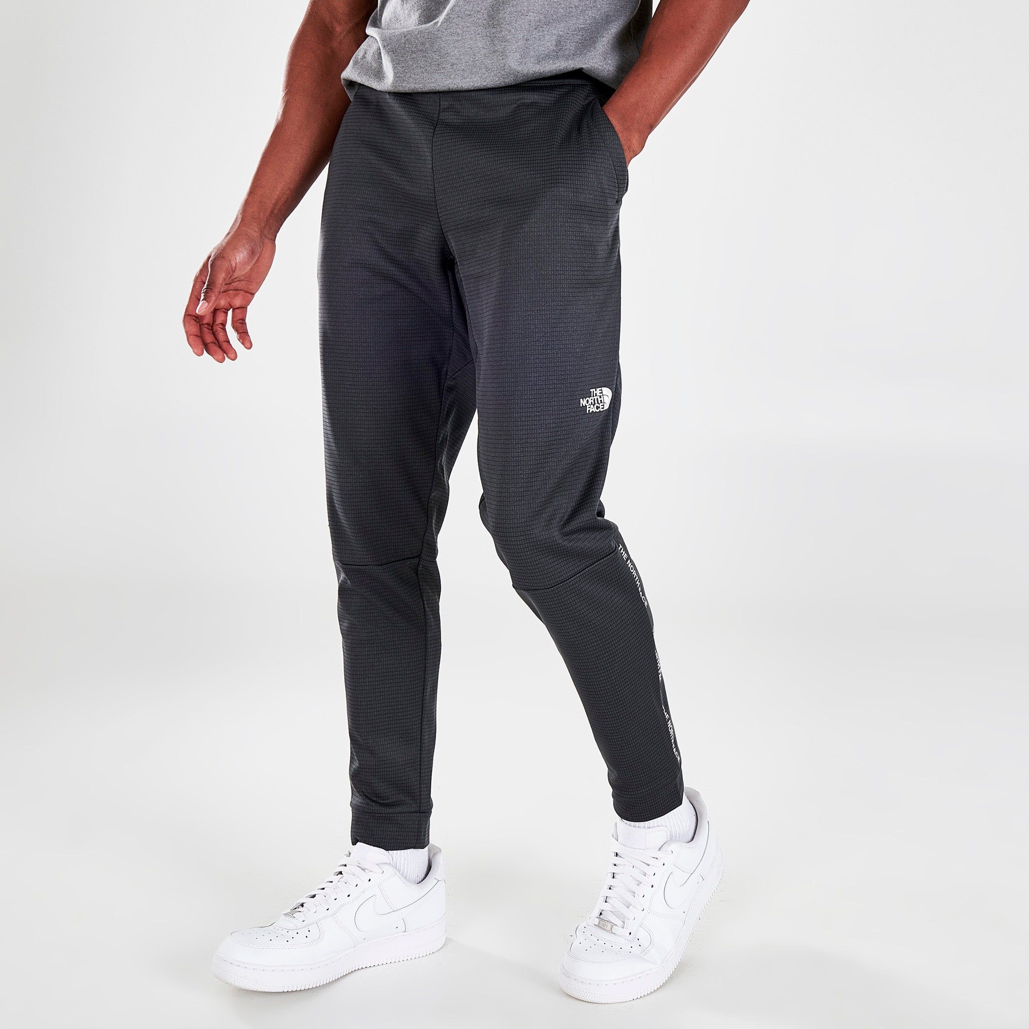 The North Face Tape Fleece Jogger Pants / Asphalt sold by JD Sports
