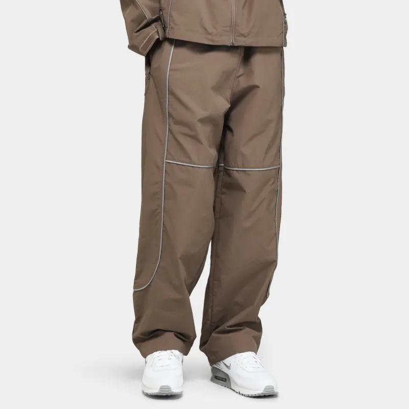 The North Face Tek Piping Wind Pants / Falcon Brown sold by JD Sports