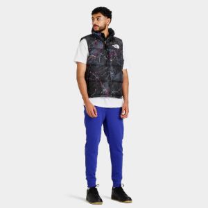 The North Face 1996 Retro Nuptse Vest / TNF Black Trail Glow Print sold by JD Sports