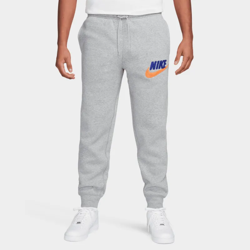 Nike Sportswear Club Fleece Chenille Futura Joggers Dark Grey Heather / Safety Orange sold by JD Sports