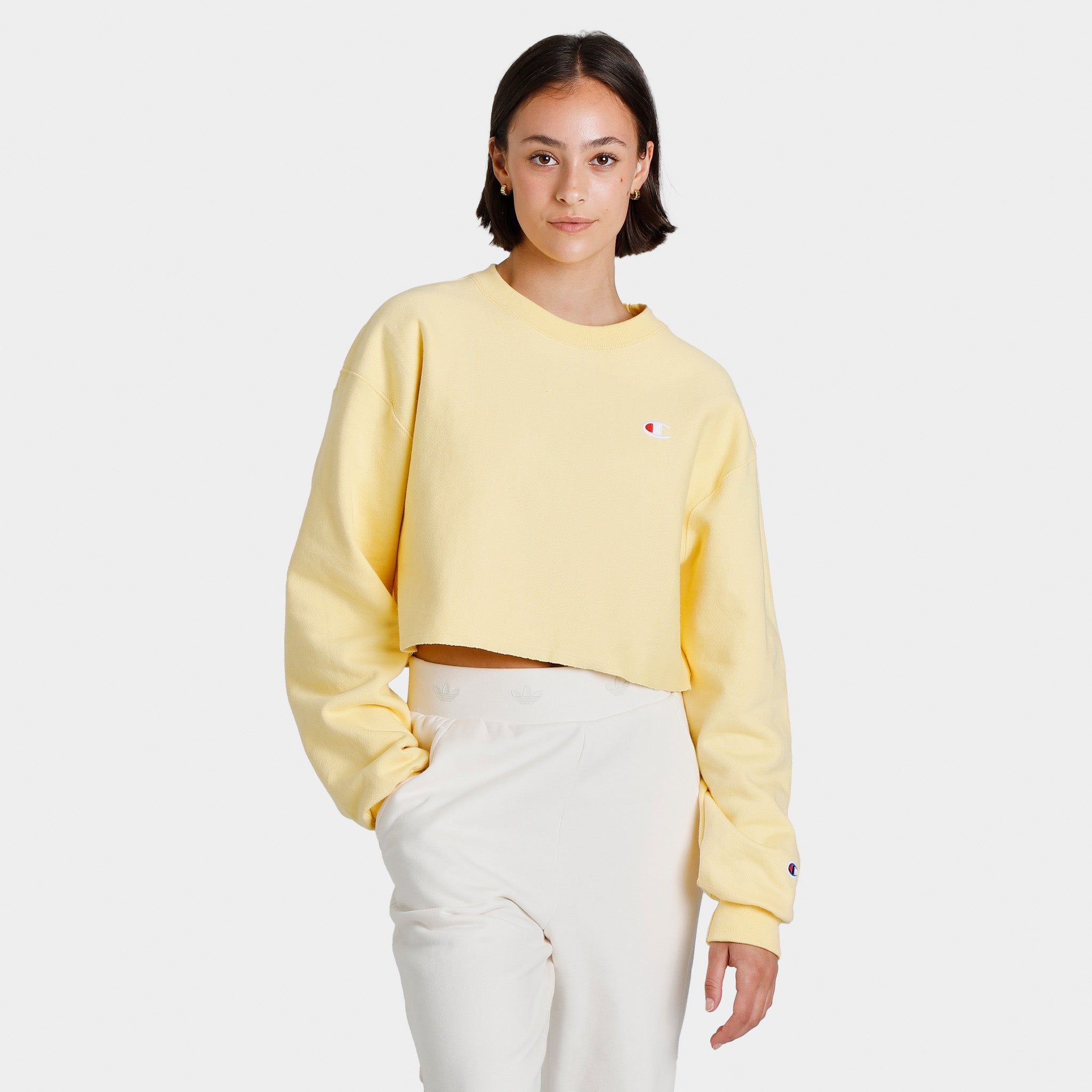 Champion Women’s Reverse Weave Cropped Cut-Off Crew Sweatshirt / Buttered Popcorn sold by JD Sports