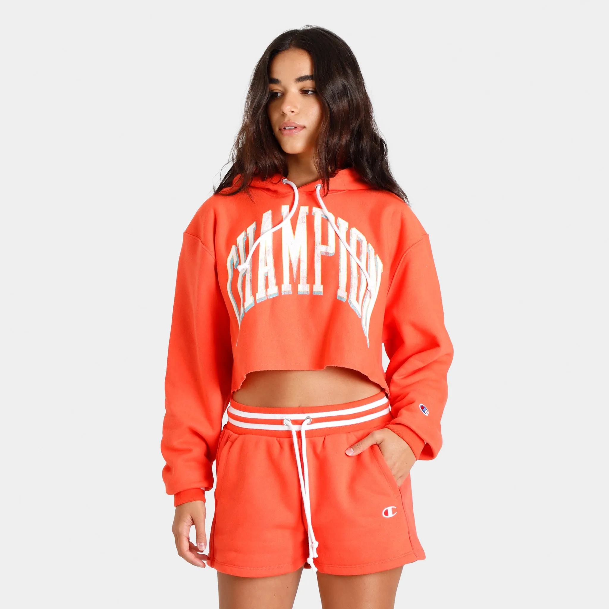 Champion Women’s Yarn-Dyed Reverse Weave Cropped Pullover Hoodie / Poppy Orange sold by JD Sports