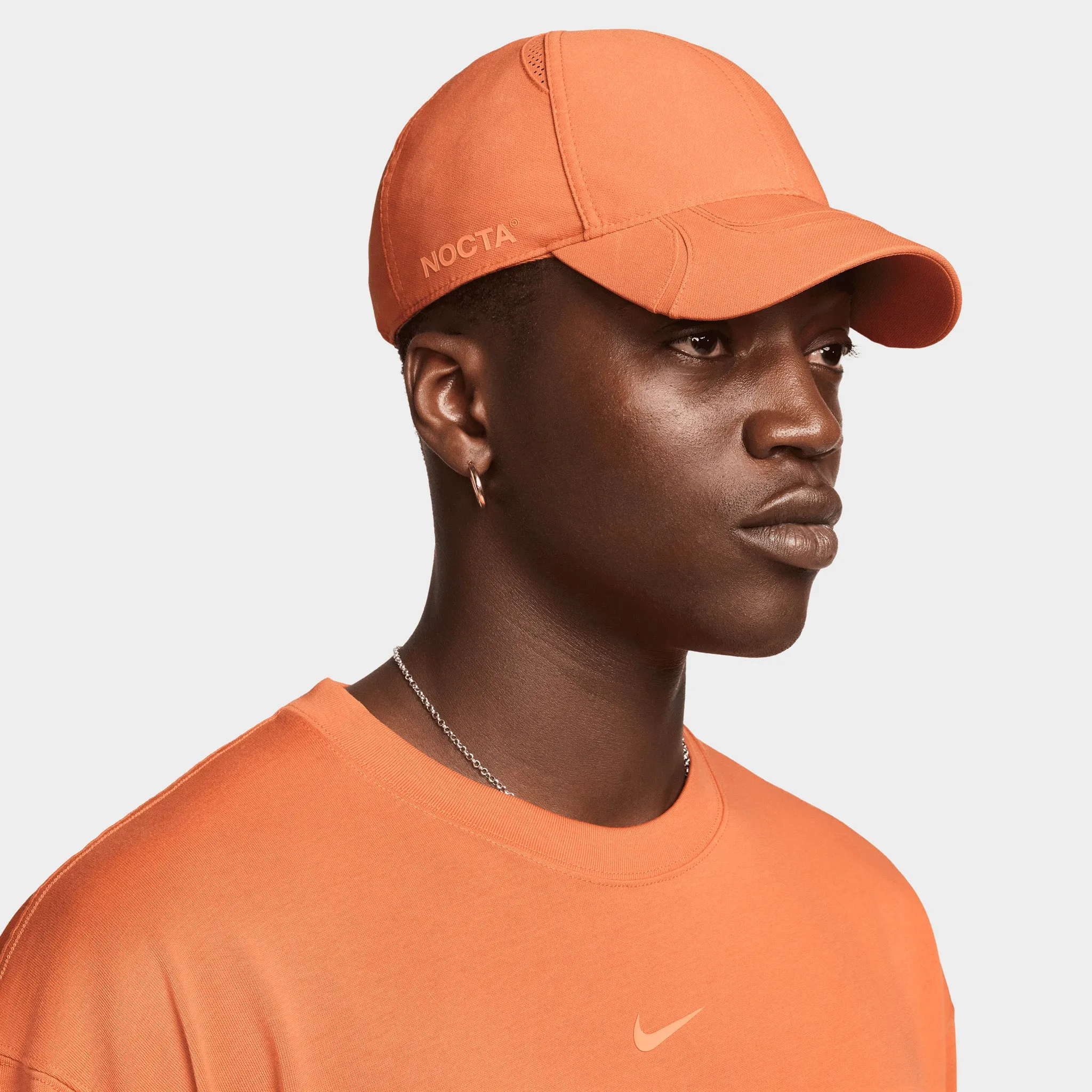 Nike Nocta NRG Club Cap Hot Curry / Orange Trance sold by JD Sports