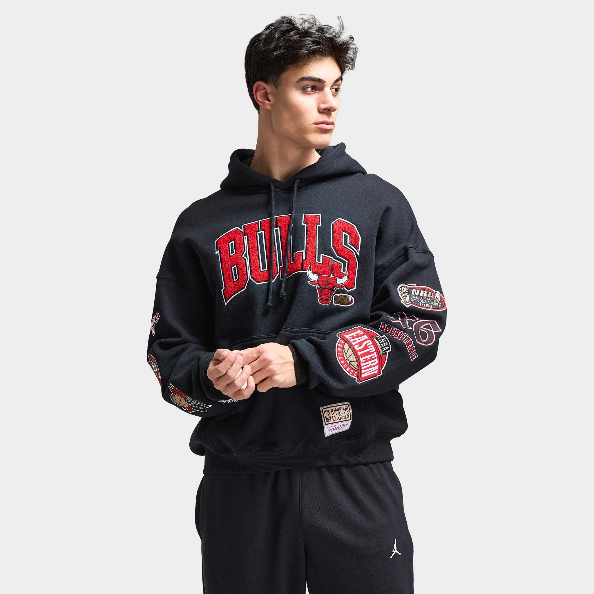 Mitchell & Ness Bulls Arch Multi Logo Hoodie / Black sold by JD Sports