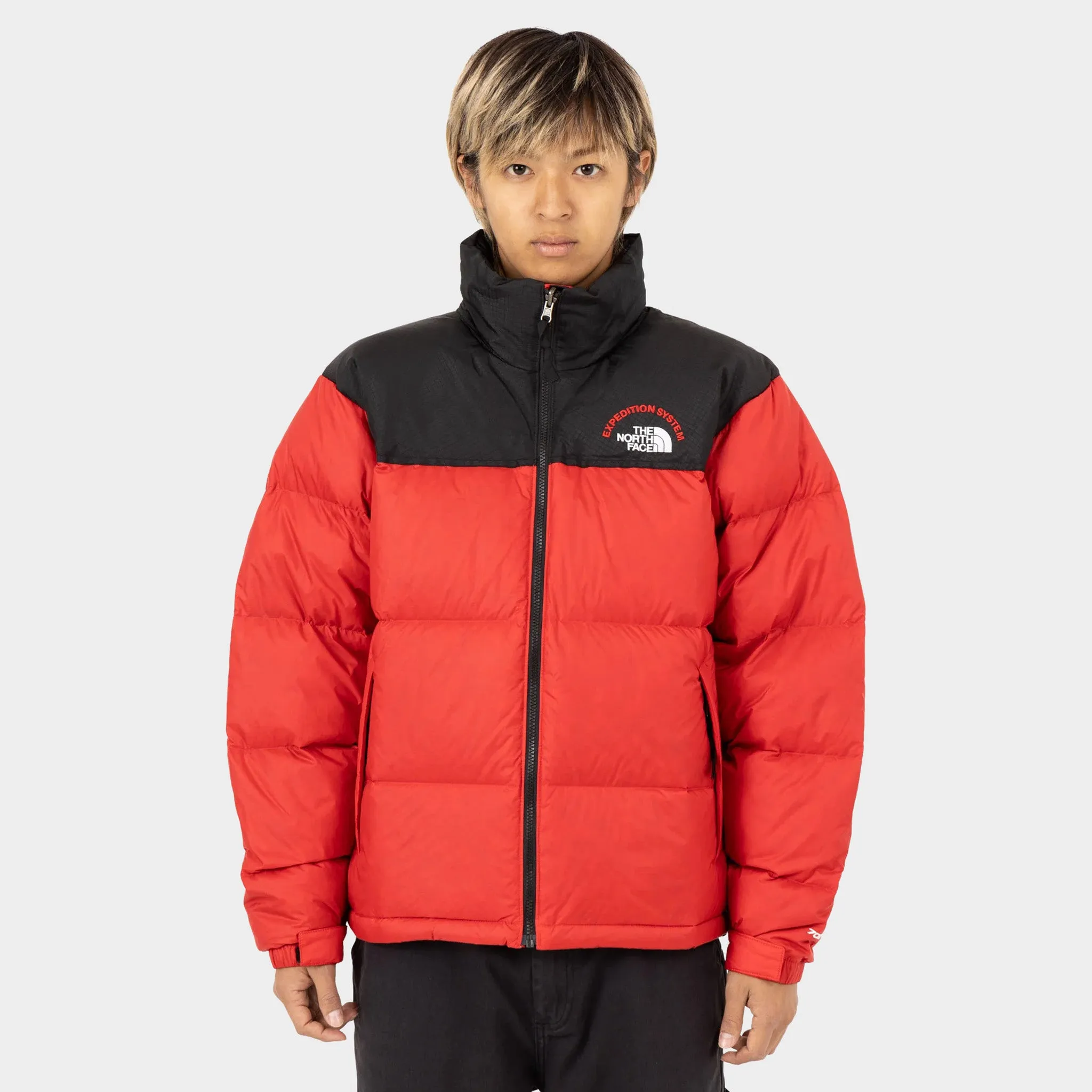 The North Face 1996 Retro Nuptse Jacket TNF Red / TNF Black sold by JD Sports