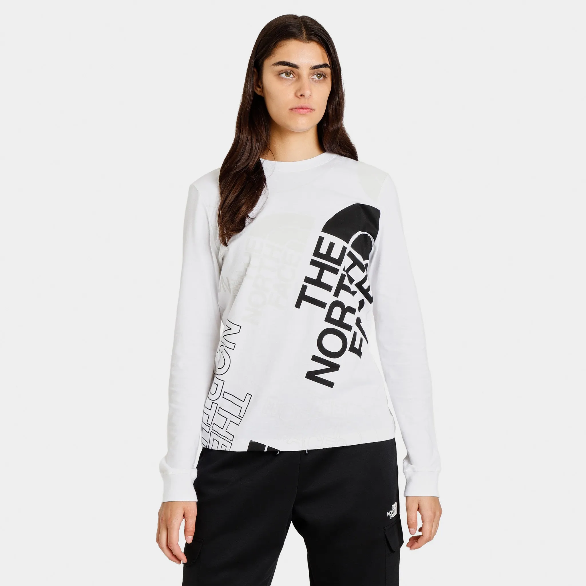 The North Face Women’s Graphic Injection Long Sleeve T-shirt TNF White / Tin Grey sold by JD Sports
