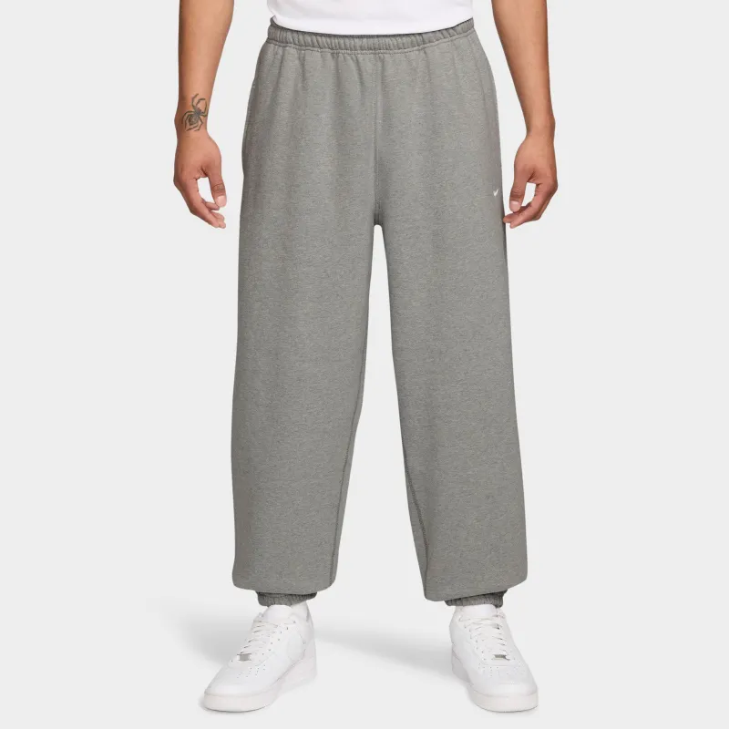 Nike Solo Swoosh Fleece Pants Dark Heather Grey / White sold by JD Sports